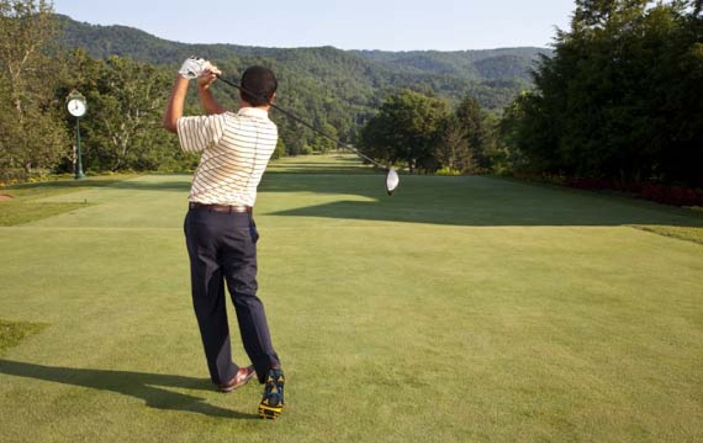 Golfer on fairway.