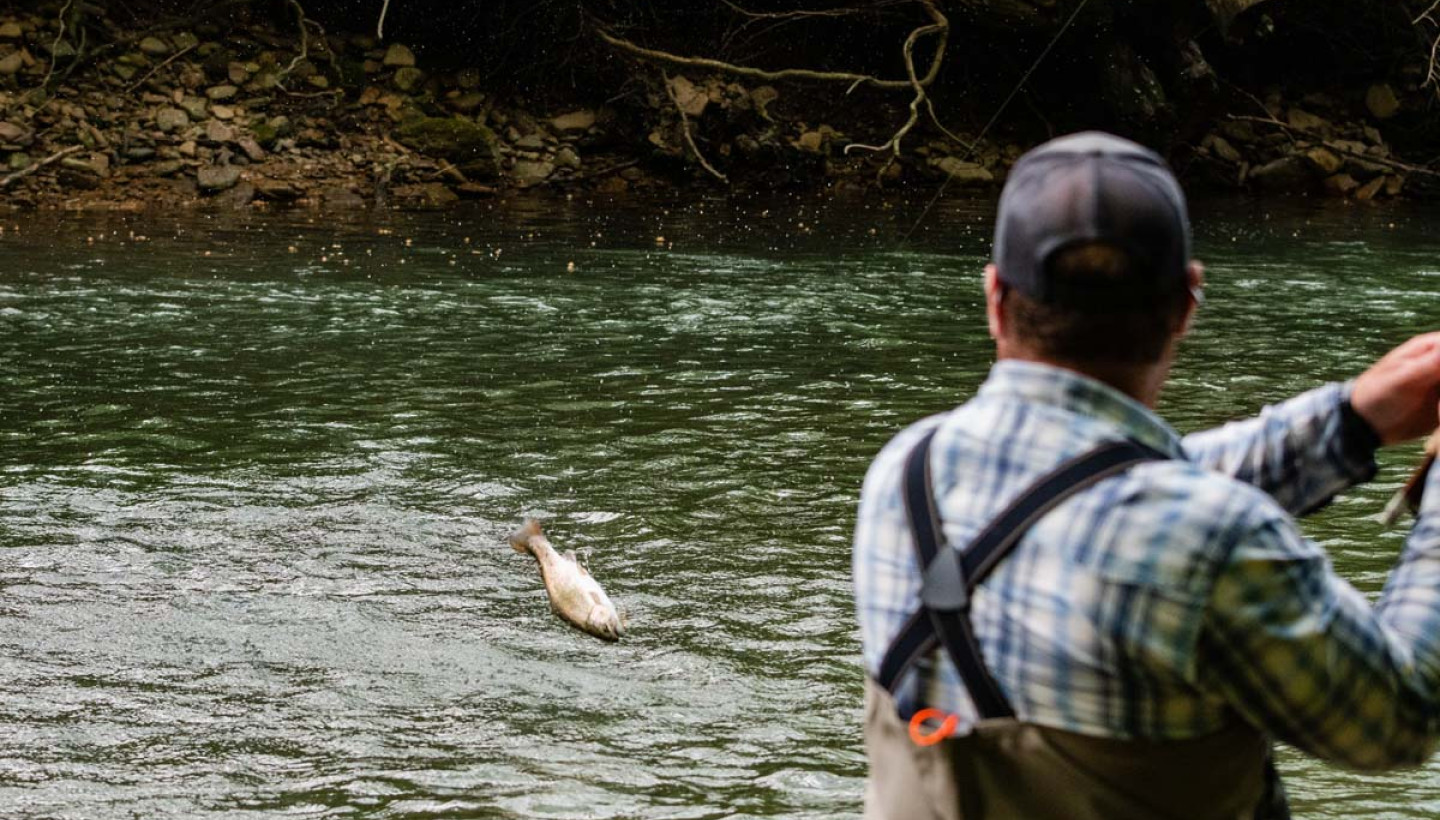 Man fishing on river