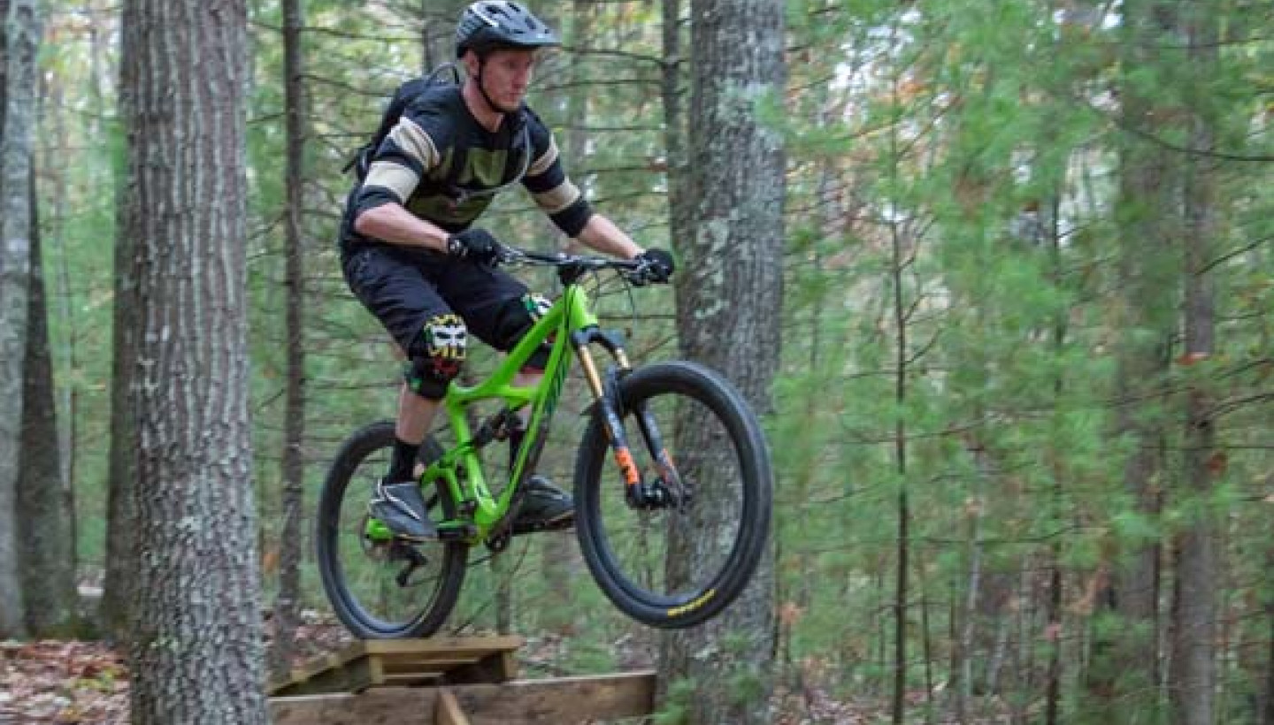 Mountain Biker on green bike