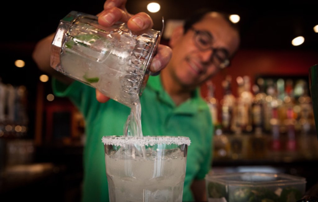 Del Sol Cantaina and Grille -  Bartender pouring drink.