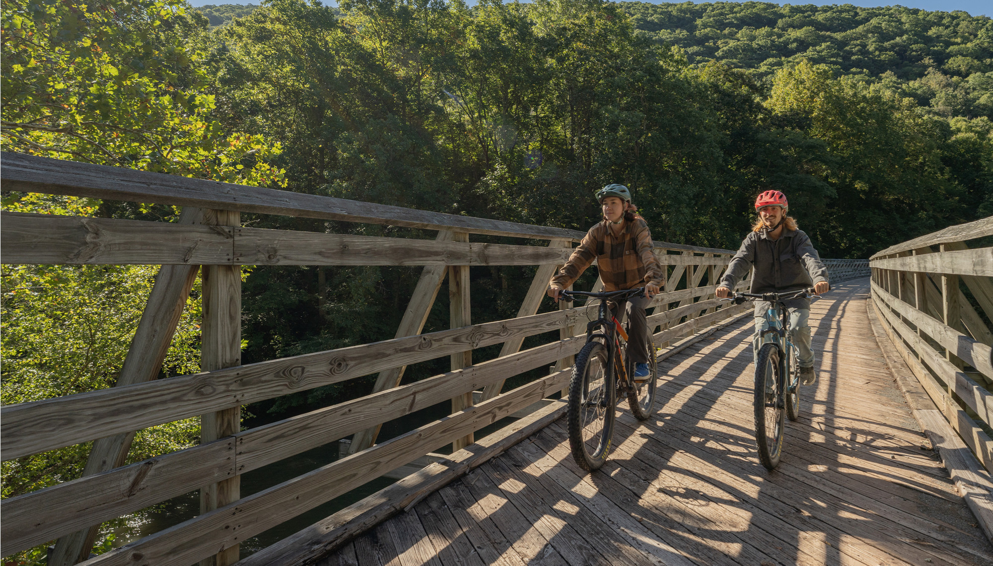 Bike riders on wooden bridge