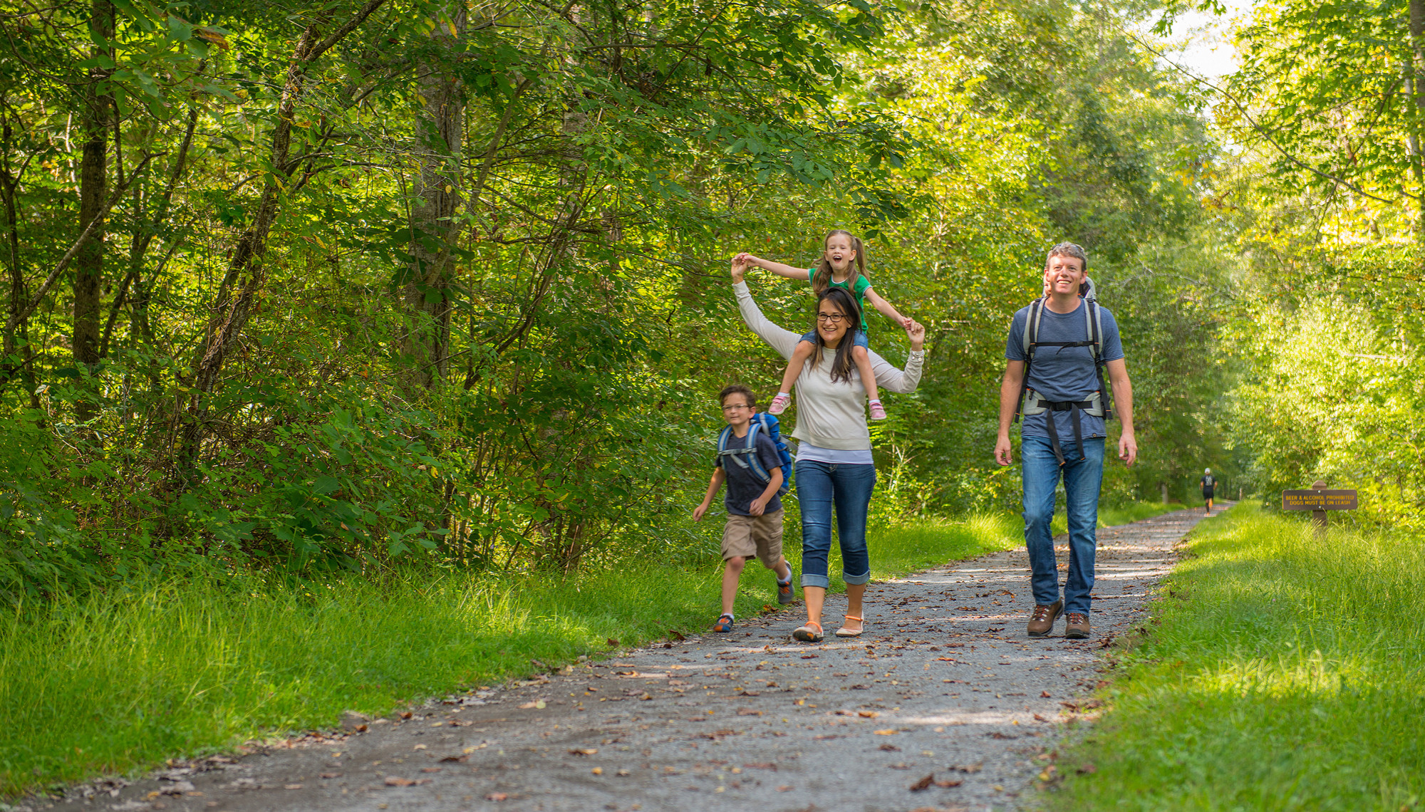 family walking in woods