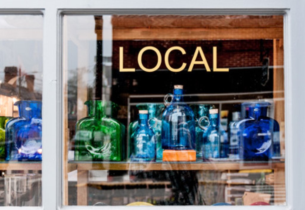 Local store window with glass jars.